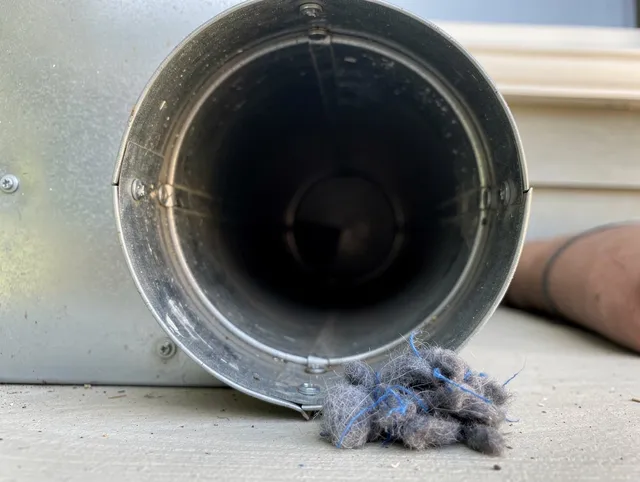 Bluffton Dryer Vent Cleaning technician using specialized equipment to clear severe dryer vent blockage in Bluffton